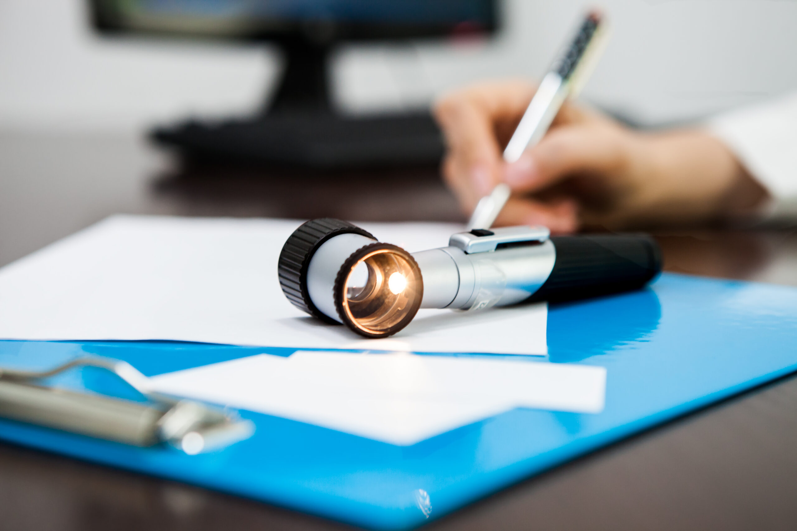 Dermatologist writing prescription